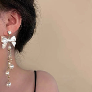 White Bow Pearl Dangler Earrings